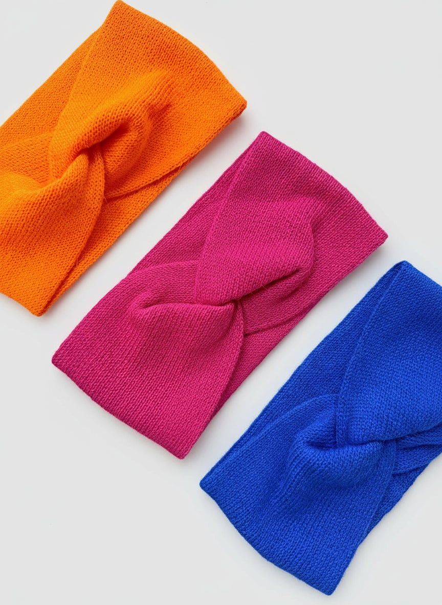 Three colorful headbands (orange, pink, blue) handmade of 100% Baby Alpaca in Boliviy by TINKU