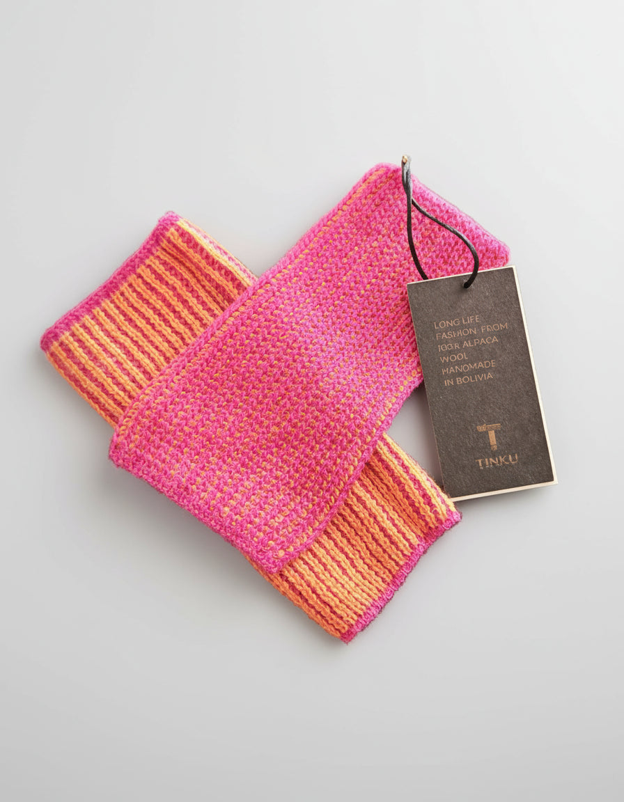 Pink and orange woven fabric with a Tinku tag on a white background