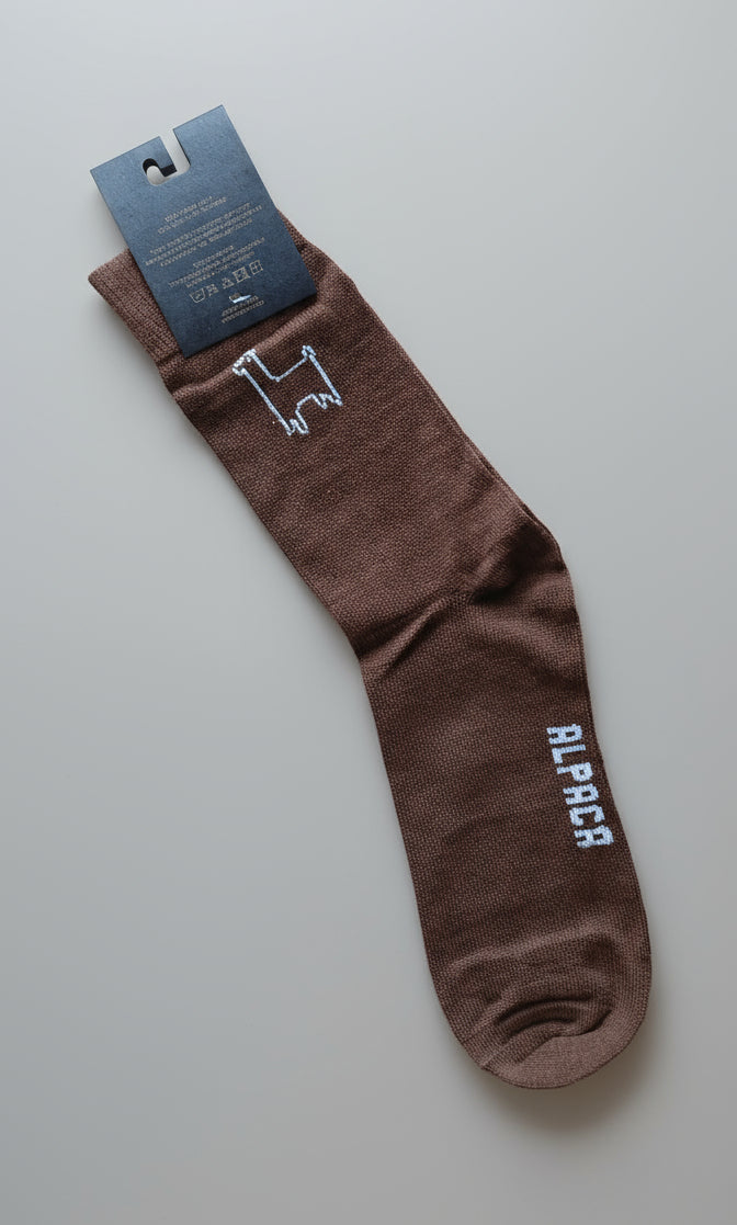 Brown alpaca sock with a brand logo TINKU made in Bolivia